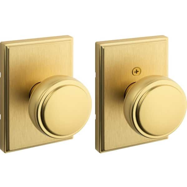 Paire de boutons de porte ronds en laiton doré mat.